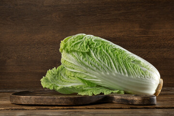 Fresh ripe Chinese cabbage on wooden table