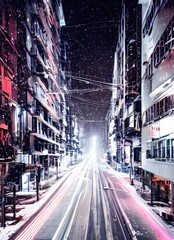 In the city, evening is falling and snow is gently drifting down onto the street below. The lights from buildings and cars illuminate the scene in a soft glow. It's quiet and peaceful.