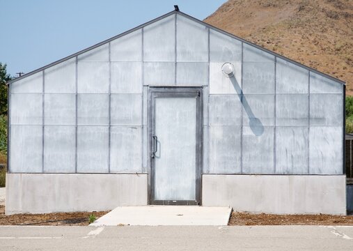 Front Of Bare White Building With Door No Windows Isolated