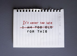 Torn paper on gray background with text written I AM TOO OLD FOR THIS, changed to IT IS NEVER TOO LATE FOR THIS - to replace negative self criticism to positive self talk with growth mindset - obrazy, fototapety, plakaty