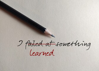 Pencil on beige background with handwritten text I FAILED AT SOMETHING, changed to I LEARNED...