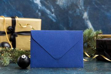 Letter to Santa with Christmas ball on dark background, closeup