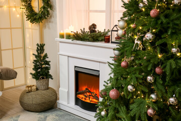 Interior of living room with fireplace, Christmas trees and window