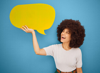 Black woman with yellow speech bubble, afro and blue background mockup space for advertising or product placement. Smile, announcement sign and woman excited for social media sale launch. - obrazy, fototapety, plakaty