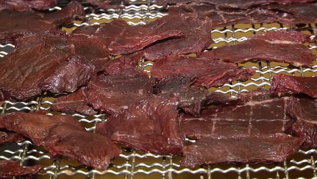 Homemade Dried Barbecue Bacon Jerky with Salt.