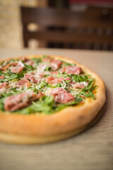 pizza with prosciutto and arugula