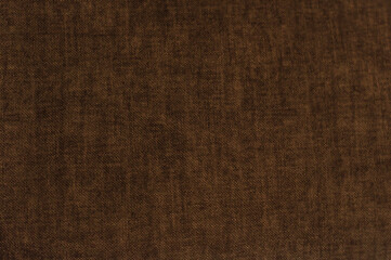Fototapeta na wymiar Texture of fabric for furniture of rich brown color. noisy structure