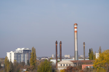 Obraz premium The chimney of a thermal power plant, the smoke extracted by a thermal power plant on the chimney, in the production process. Environment. Pollution.