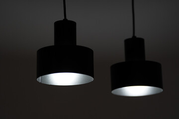 two black lamps on. electricity. design. detail.