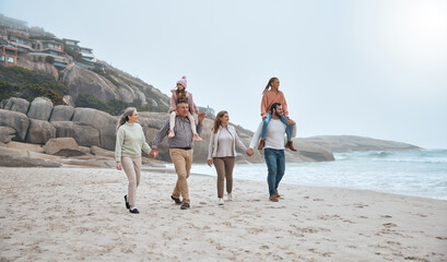 Family, walking and holding hands on beach holiday vacation. Happy grandparents, parents and...