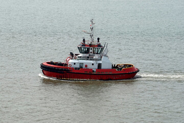 Tugboat maneuver in Tanjung Perak port area, Surabaya, Indonesia, August 2022