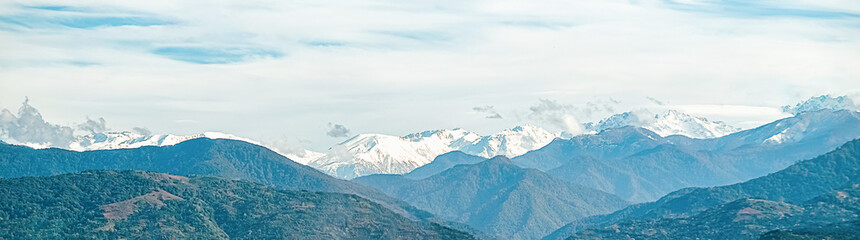 mountains. Travel to the mountains. Hiking in the mountains, the road for a trip to travel. mountain landscape banner.Beautiful panorama view of snowy mountains