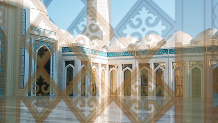 Arabic mosque, arch and dome closeup view through glass with oriental traditional pattern