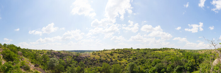Fototapeta na wymiar Panoramic view of Arbuzynsky canyon is a canyon near the Trykraty village, on the Arbuzynka river in the Voznesenskyi region of Mykolaiv Oblast of Ukraine