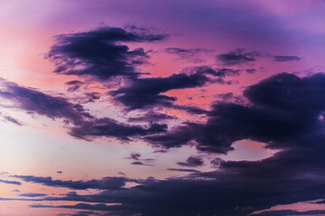 Fototapeta premium Beautiful clouds in different colors and shapes at sunset.