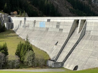 The dam Panixer or concrete dam on the reservoir lake Panixersee (Lag da Pigniu) on the slopes of...