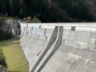 The dam Panixer or concrete dam on the reservoir lake Panixersee (Lag da Pigniu) on the slopes of...