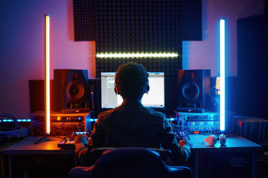 A music producer working in recording studio