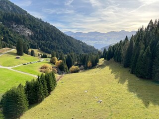 Magnificent autumn colors in the surroundings of mountain pastures and mixed forests next to the...