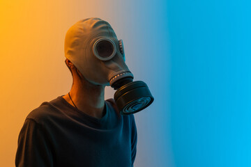 Close-up portrait of his he nice professional disinfectant wearing gas mask showing copy empty...