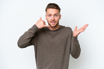 Fototapeta premium Young blonde caucasian man isolated on white background making phone gesture and doubting