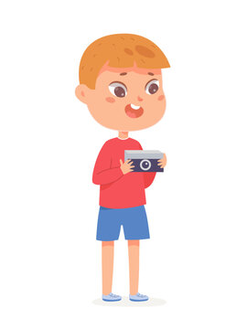 Boy holding digital camera to take photo, excited cute child journalist taking pictures