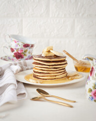 pancakes with fresh banana  , with decoration  and honey. Healthy morning breakfast. rustic style