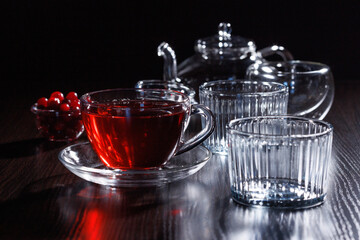 Glass tea utensils on a black background. Selective focus, close-up.