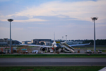 Fototapeta premium An airplane parking in the airport 