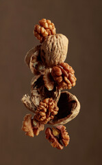 Walnuts on a brown background.