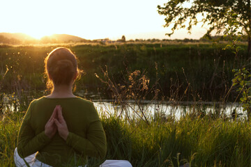 woman sitting on the grass