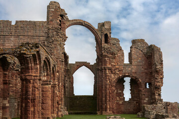 The ruins of Lindisfarne Priory, built c. 1150, Holy Island of Lindisfarne, Northumberland, England