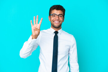 Young business Brazilian man isolated on blue background happy and counting four with fingers