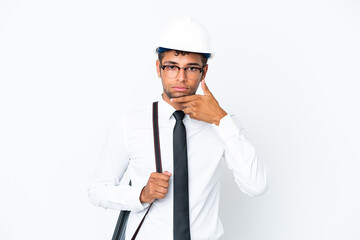 Architect brazilian man with helmet and holding blueprints thinking