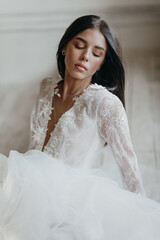 Beautiful bride posing in wedding dress. Wedding day. 