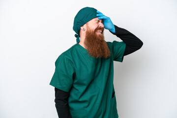 Surgeon redhead man in green uniform isolated on white background has realized something and intending the solution
