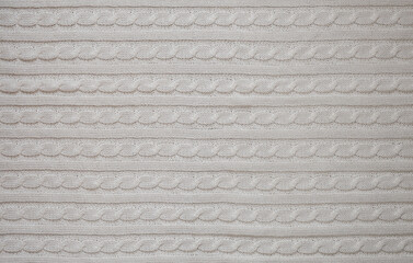 a knitted blanket. plaid with a braid pattern. background for the design.