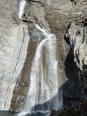 Aua dil Mer Waterfalls or Aua dil Mer Wasserfall (Wasserfälle Aua da Fluaz oder Panixer Fall) over the lake Panixersee (Lag da Pigniu), Pigniu-Panix - Canton of Grisons, Switzerland (Kanton Graubünden