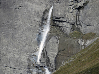 Aua dil Mer Waterfalls or Aua dil Mer Wasserfall (Wasserfälle Aua da Fluaz oder Panixer Fall) over the lake Panixersee (Lag da Pigniu), Pigniu-Panix - Canton of Grisons, Switzerland (Kanton Graubünden