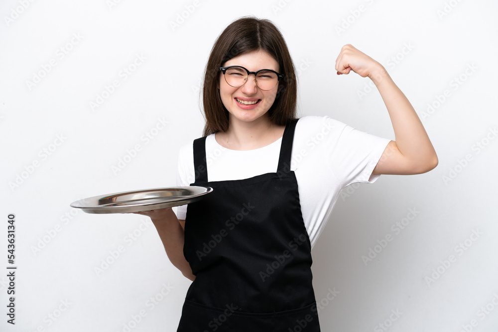 Wall mural Young Russian woman chef with tray isolated on white background doing strong gesture