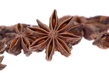 Star anise spice closeup isolated on a white background, aniseeds, christmas bakery ingredients