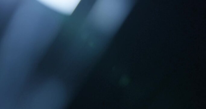 Elegant lens flare Light Leak overlay on black background. Spherical Optical Prism Light abstract background 4K
