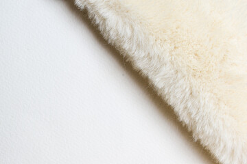 White wool texture on a white background, empty space for text.