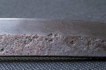 Background with a pattern of Damascus steel. Macro shot of damascus
knife texture. Damascus steel...