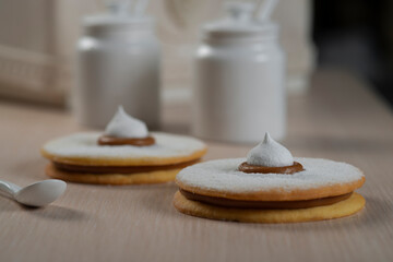 close up of fresh cookies with Bizet on table
