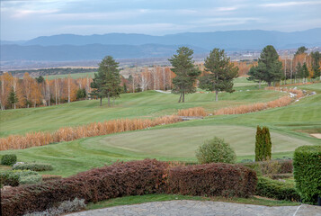 golf club view with mountains and green