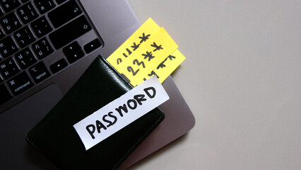 simple pin code written post it on laptop keyboard.	Password concept.