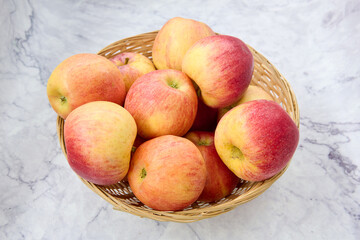 wicker basket with red apples