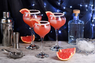 Cocktail Pink Paloma with red grapefruit with silver tequila. Refreshing organic vegetarian alcoholic drink.
