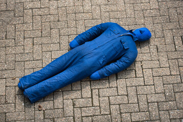 A heavy training dummy lies on the ground after the fire brigade exercise